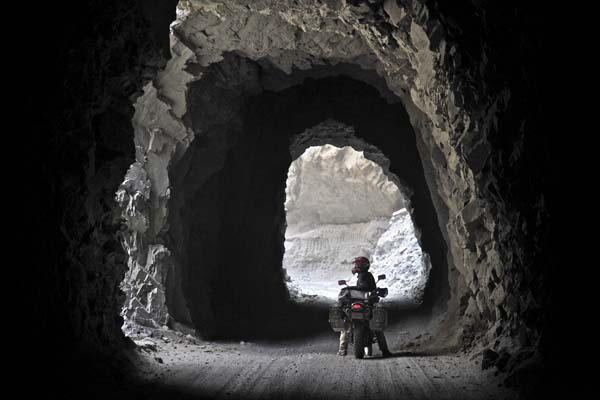 Photo by Austin Shelton, of Nishan Nalbandian, USA; The tunnels of Cañon del Pato in Peru, on Denver to Ushuaia ride, KLR650.
