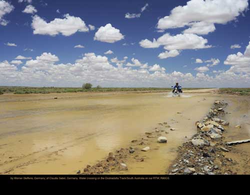 July: by Werner Steffens, Germany; of Claudia Sabel, Germany. Water crossing on the Oodnadatta Track/South Australia on our RTW; R80GS.