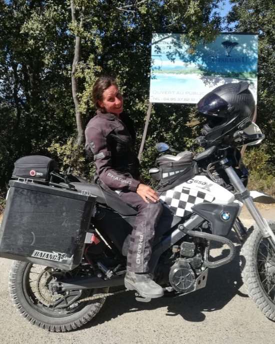 Kat Ja, on motorcycle