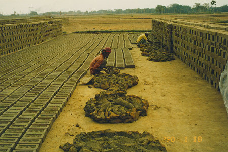 Hand making bricks for the roads