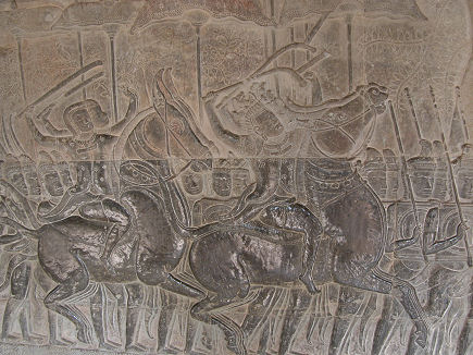 Finely carved images on the wall at Angkor Wat