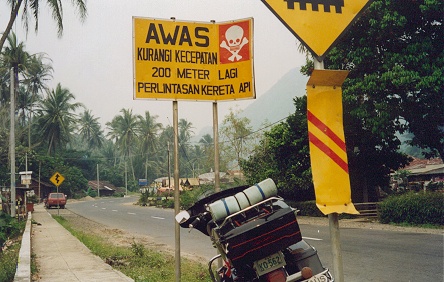 A graffic road sign even if you can't read Indonesian