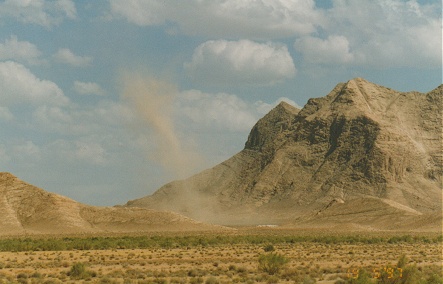 Dust devils, willy willy's, form over the hot desert in the afternoons