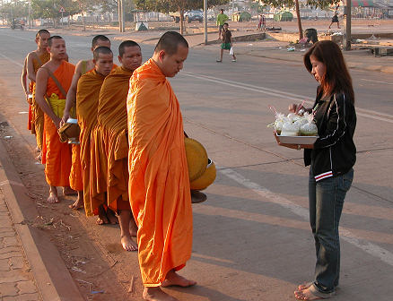 Monks collecting alms at dawn