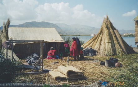 The Uros people living on the floating totora reeds, which grow in the bay of Puno