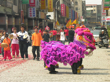 Small street parade outside Baoan Temple