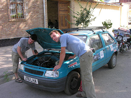 Checking over the now repaired car, on with the rally to Mongolia