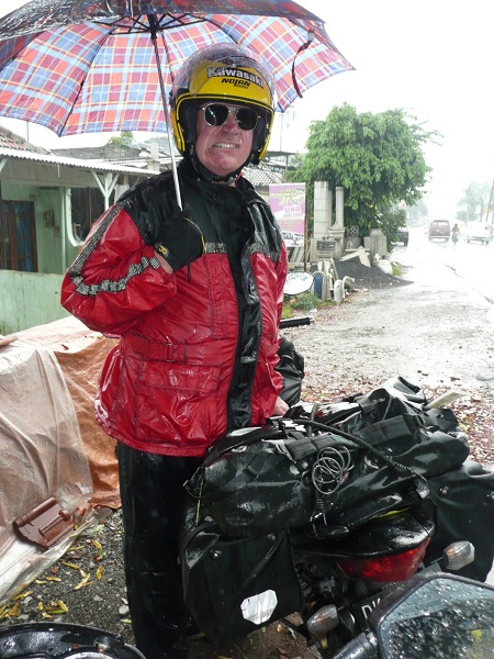 Standing in the rain in Java, this pictured what I thought about paying for the adventure of piloting again a motorcycle across India, North Africa, the middle east or paying to fly over those areas where I would not be granted a visa.