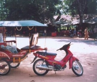 Honda 110-cc Wave towing a rickshaw.