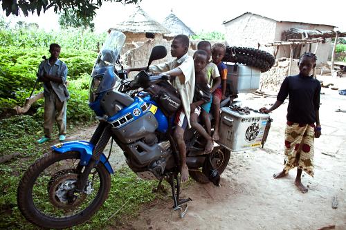 Children on motorcycle, Mali village.