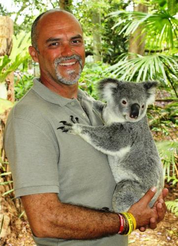 Ronnie cuddles a koala.