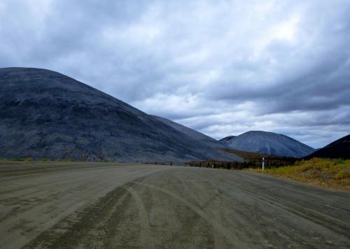 Grey mounds on the Dempster Highway, Canada.
