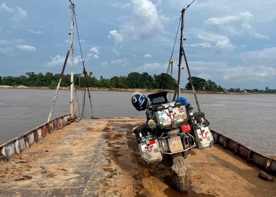 Tom Lill, motorcycle on ferry deck.