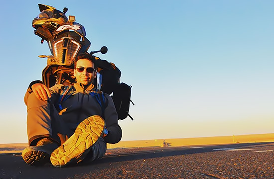 David Garces with bike in the desert