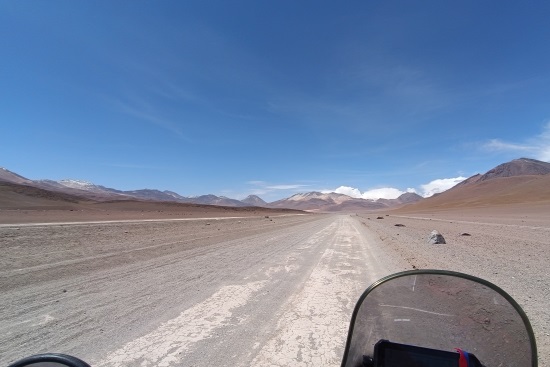 Bernd Meyer, View of a dusty dirt road from the bike.