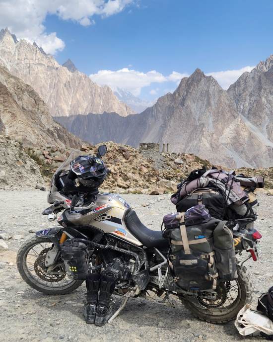 Kathleen Perry, Motorcycle with mountainous background.