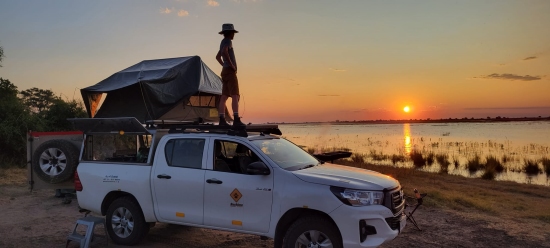 Mark Brunson, Watching the sunset with a truck rooftop tent, Namibia and Botswana trip.