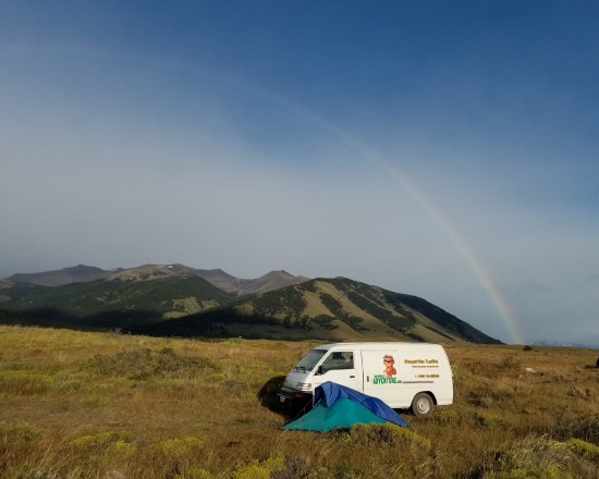 Mark Brunson, Camper van with rainbow.