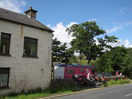Helen's old forge house, pink motorhome, and pink hair