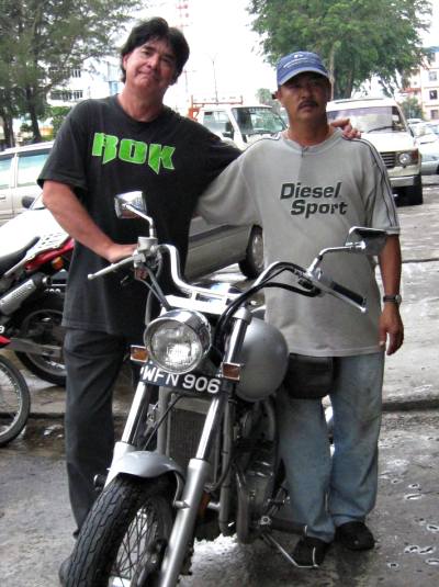 A rental Kawasaki Nomad was about $80.00 per day. The owner of the rental shop, pictured here on the right, imported "big bikes" from Japan and the United States. 