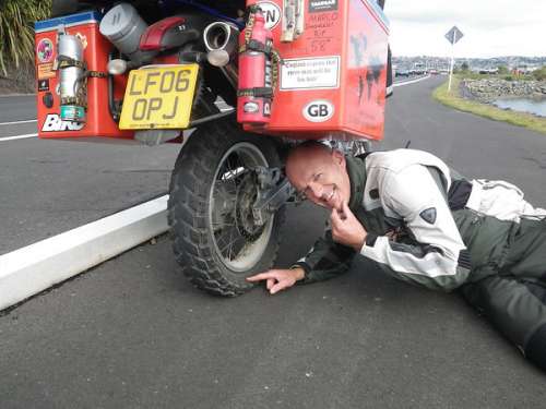 Paul and Angie, puncture in back tyre, New Zealand.